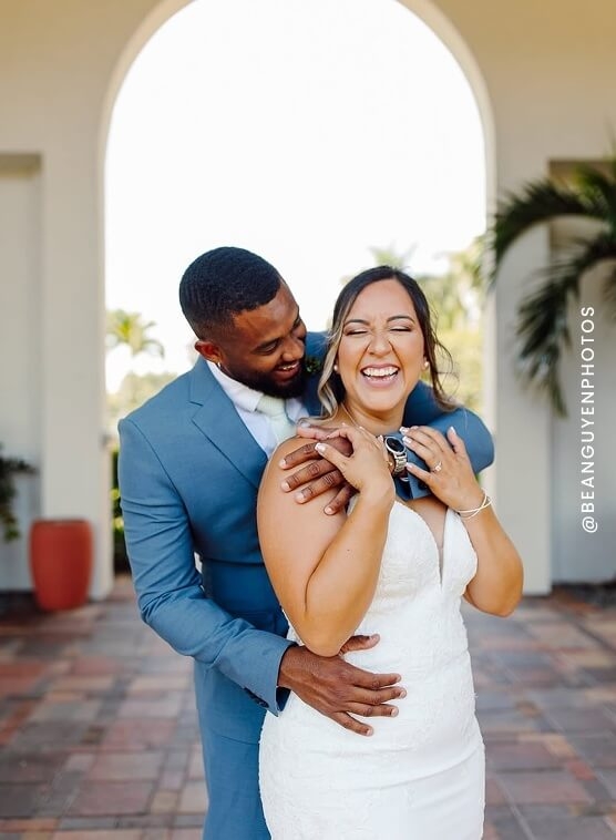 Сouple wearing a white gown and a blue suit